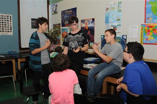 middle school students discussing social studies 