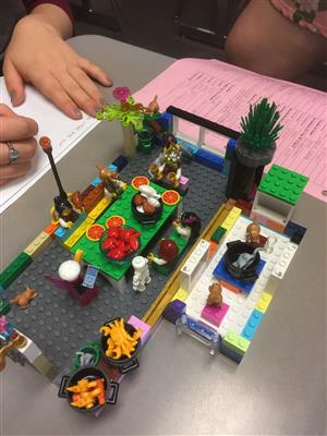 Students built rooms of a house and discussed the details in French. 