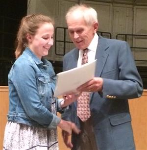 Stan Roth handing out a scholarship bearing his name. 