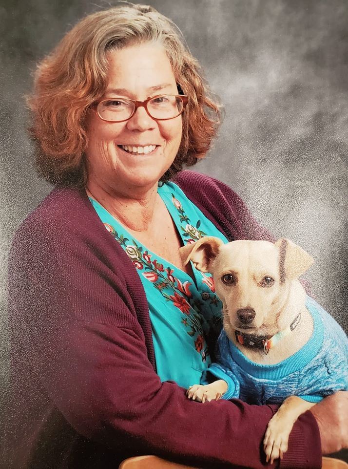 Picture of H-B and her service dog Chica.